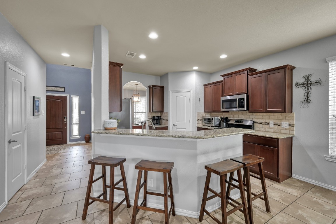 3562 Hamilton Bend Lane Spring, TX 77386 - Photo 5 of 17 With granite countertops, stainless steel appliances, generous cabinet space, and a great flow into the rest of the home, this kitchen is ready for real life.