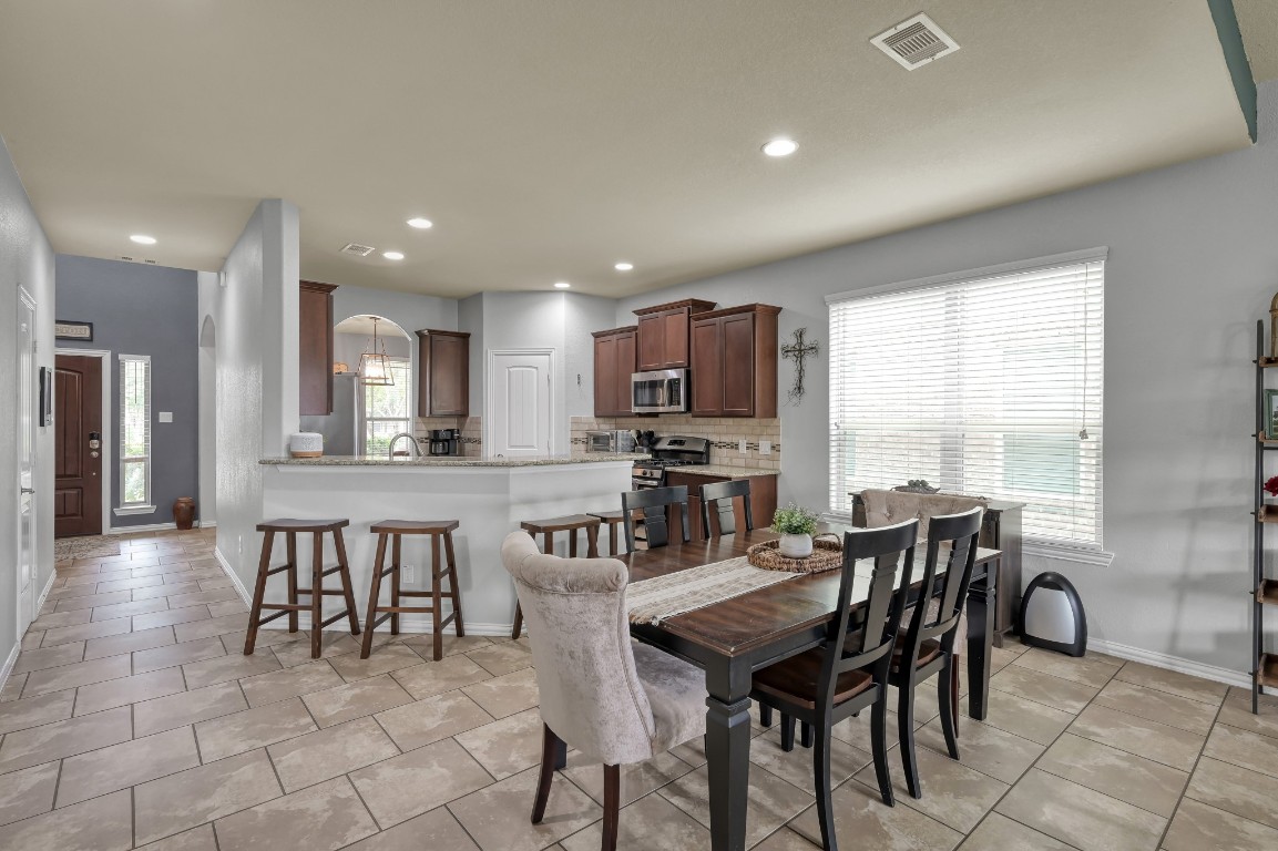 3562 Hamilton Bend Lane Spring, TX 77386 - Photo 6 of 17 The dining area sits right off the kitchen with plenty of natural light, creating an easy spot for family dinners, Saturday pancakes, or casual meals with friends.