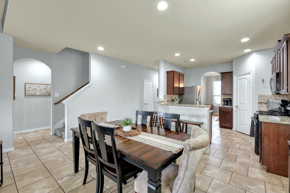 3562 Hamilton Bend Lane Spring, TX 77386 - Photo 7 of 17 The breakfast bar adds extra seating and makes the kitchen feel connected to the rest of the home — perfect for quick breakfasts, after-school snacks, or chatting while dinner is cooking.