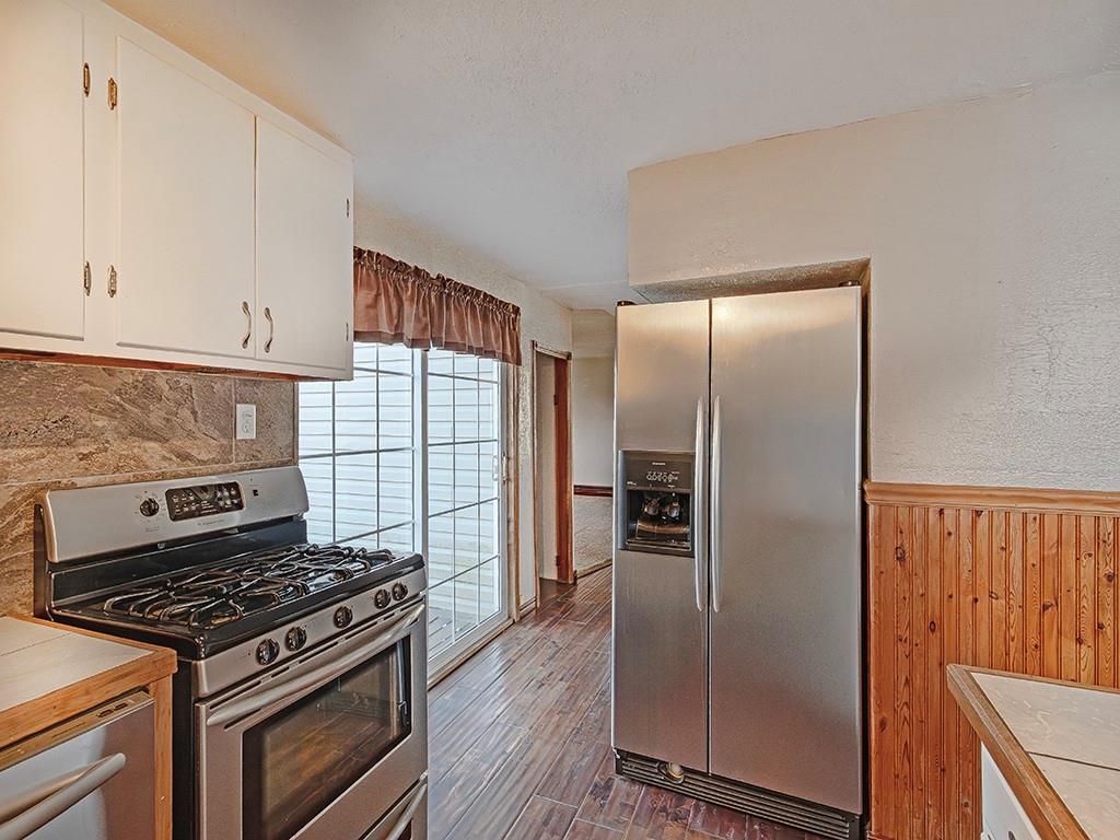 223-227 Old Mill Road Apollo, PA 15613 - Photo 14 of 45 a kitchen with granite countertop a refrigerator stove and cabinets