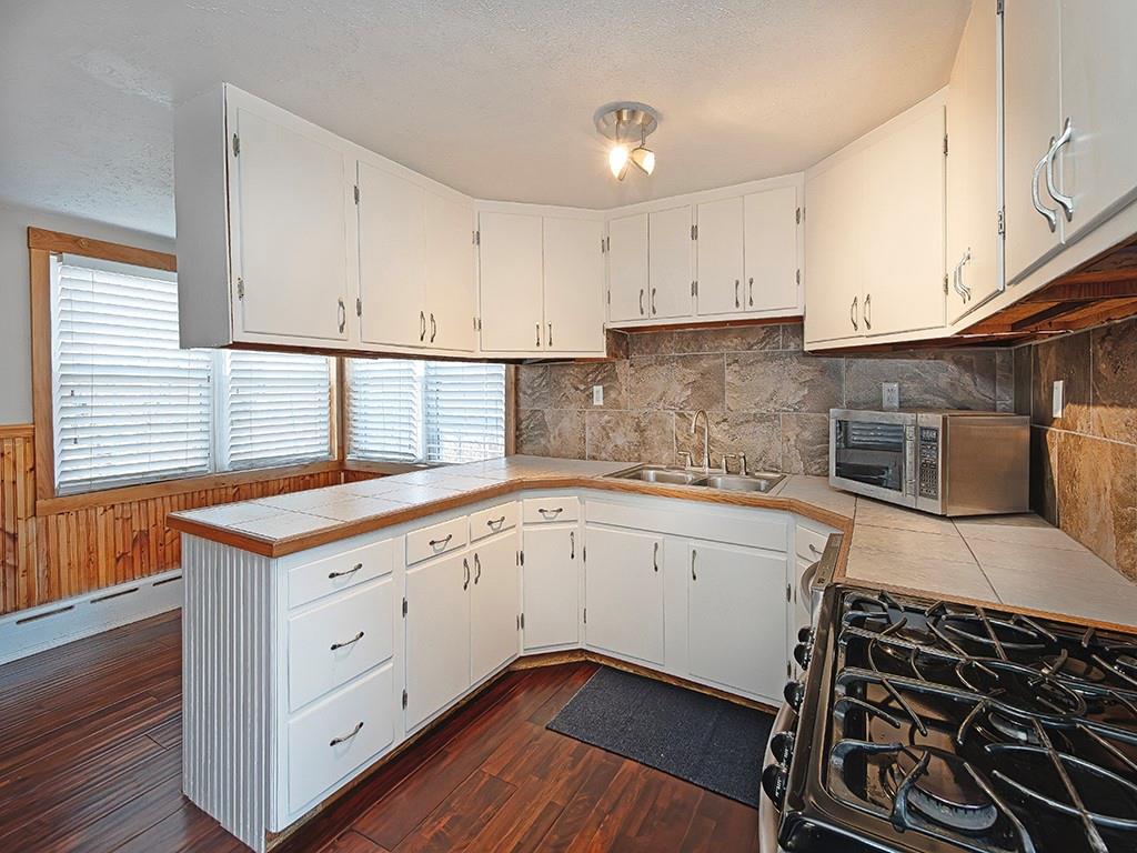 223-227 Old Mill Road Apollo, PA 15613 - Photo 16 of 45 a kitchen with granite countertop white cabinets and white appliances