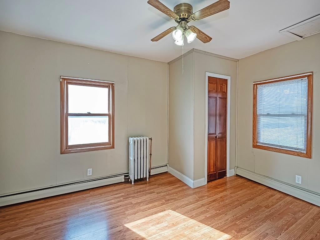 223-227 Old Mill Road Apollo, PA 15613 - Photo 21 of 45 a view of an empty room with wooden floor and a window