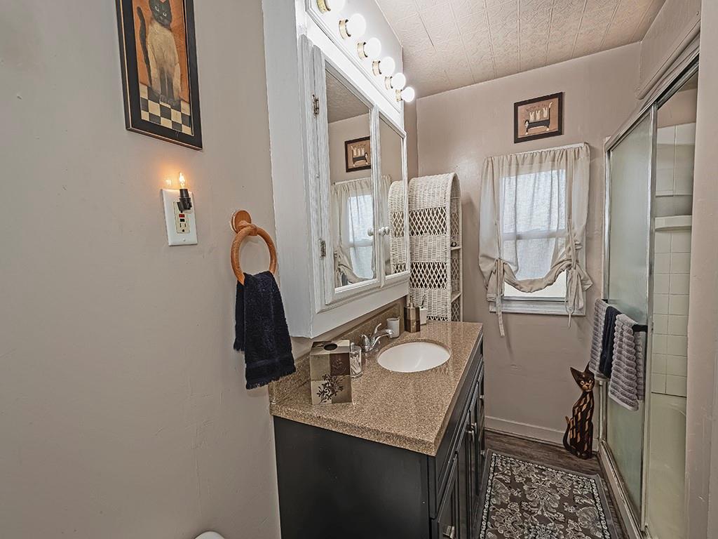 223-227 Old Mill Road Apollo, PA 15613 - Photo 30 of 45 a bathroom with a granite countertop sink toilet and a mirror
