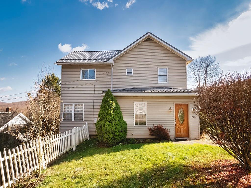 223-227 Old Mill Road Apollo, PA 15613 - Photo 3 of 45 a front view of a house with a yard and garage