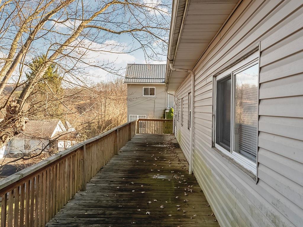 223-227 Old Mill Road Apollo, PA 15613 - Photo 39 of 45 a view of a balcony with wooden floor and fence