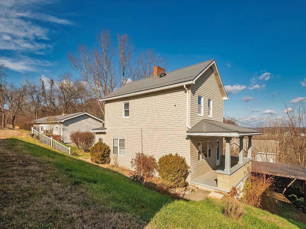 223-227 Old Mill Road Apollo, PA 15613 - Photo 4 of 45 a front view of a house with garden