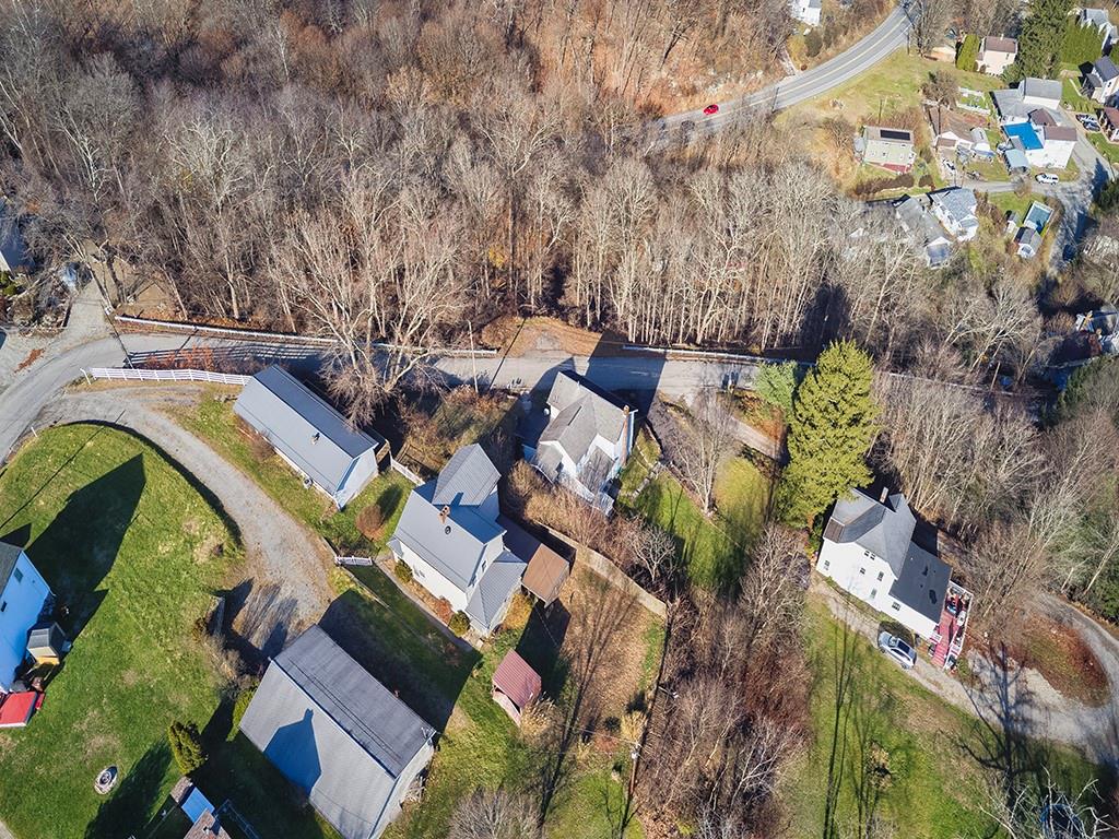 223-227 Old Mill Road Apollo, PA 15613 - Photo 43 of 45 an aerial view of a house with a yard and lake view