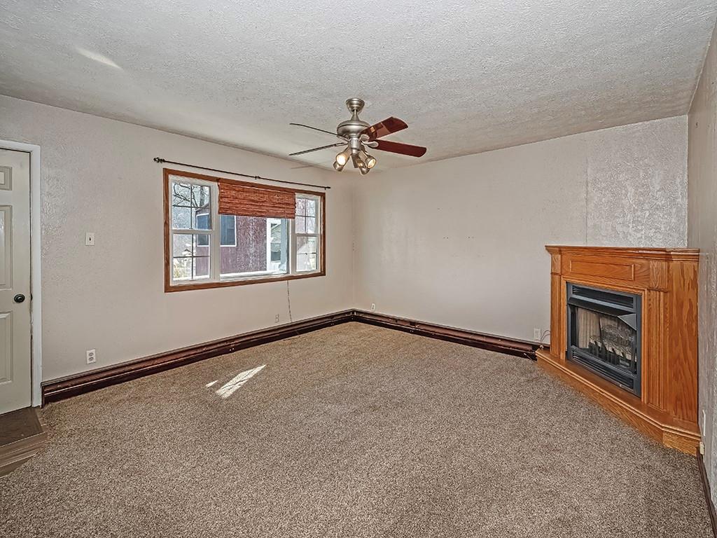 223-227 Old Mill Road Apollo, PA 15613 - Photo 9 of 45 an empty room with windows and fireplace