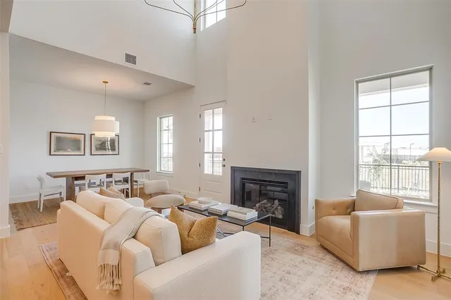 a living room with furniture window and a fireplace