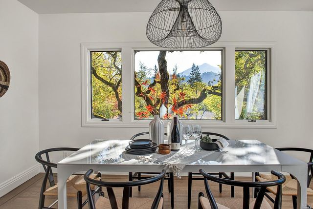 a view of a dining room with furniture window and outside view