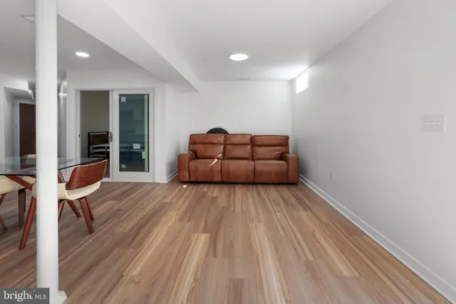 a room with wooden floor and furniture