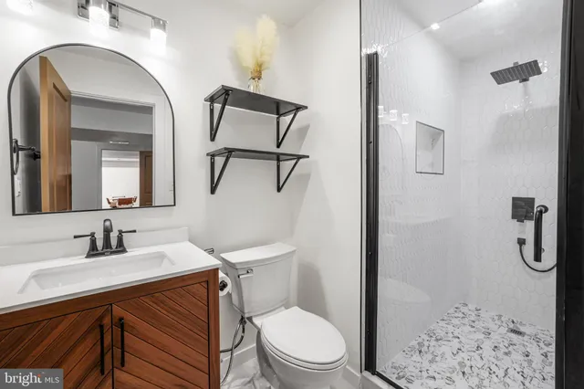 a bathroom with a toilet sink and shower