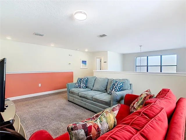 a living room with furniture and a couch