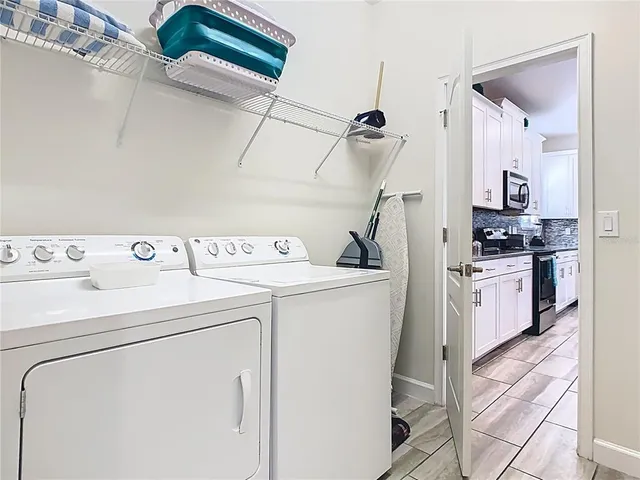 a utility room with dryer and washer