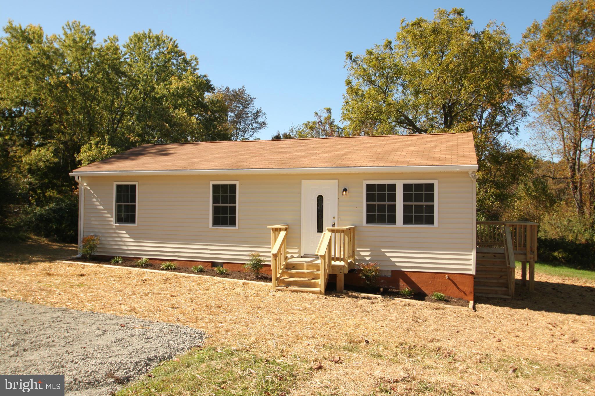 14394 Shanktown Road Reva, VA 22735 - Photo 18 of 18 a front view of a house with a yard covered in snow
