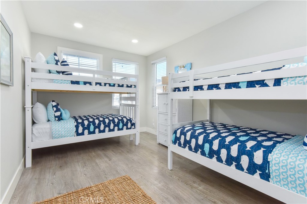 16791 Bayview Drive Huntington Beach, CA 90742 - Photo 29 of 75 a bedroom with a bed and window