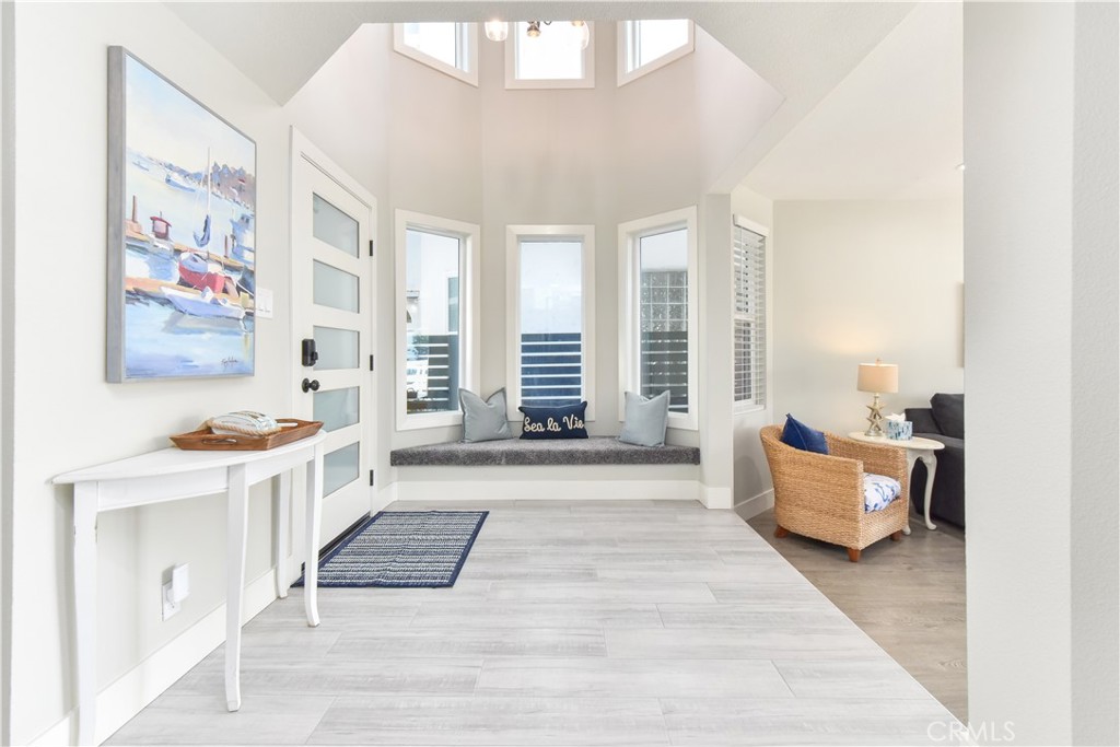 16791 Bayview Drive Huntington Beach, CA 90742 - Photo 3 of 75 a spacious bedroom with a bed and a couch