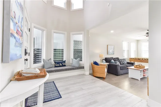 a bedroom with a bed and a lamp on dresser