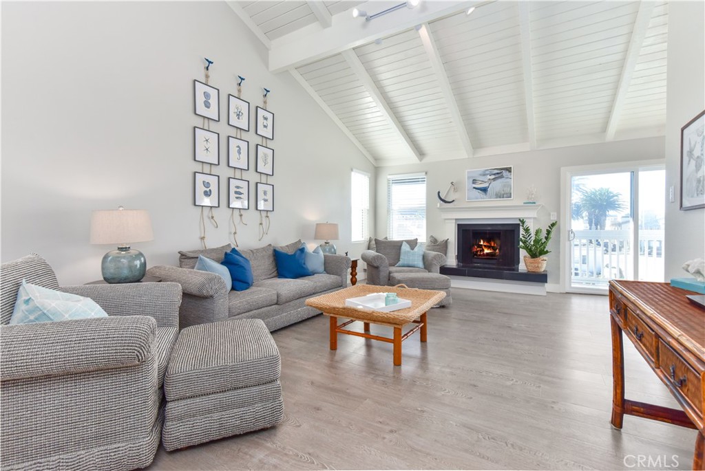 16791 Bayview Drive Huntington Beach, CA 90742 - Photo 37 of 75 a living room with furniture and a fireplace