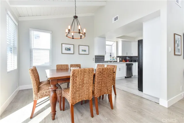 a bathroom with a sink a toilet a mirror and shower