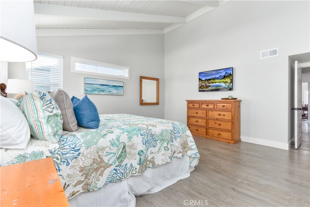 16791 Bayview Drive Huntington Beach, CA 90742 - Photo 53 of 75 a bed sitting in a bedroom and painting on the wall