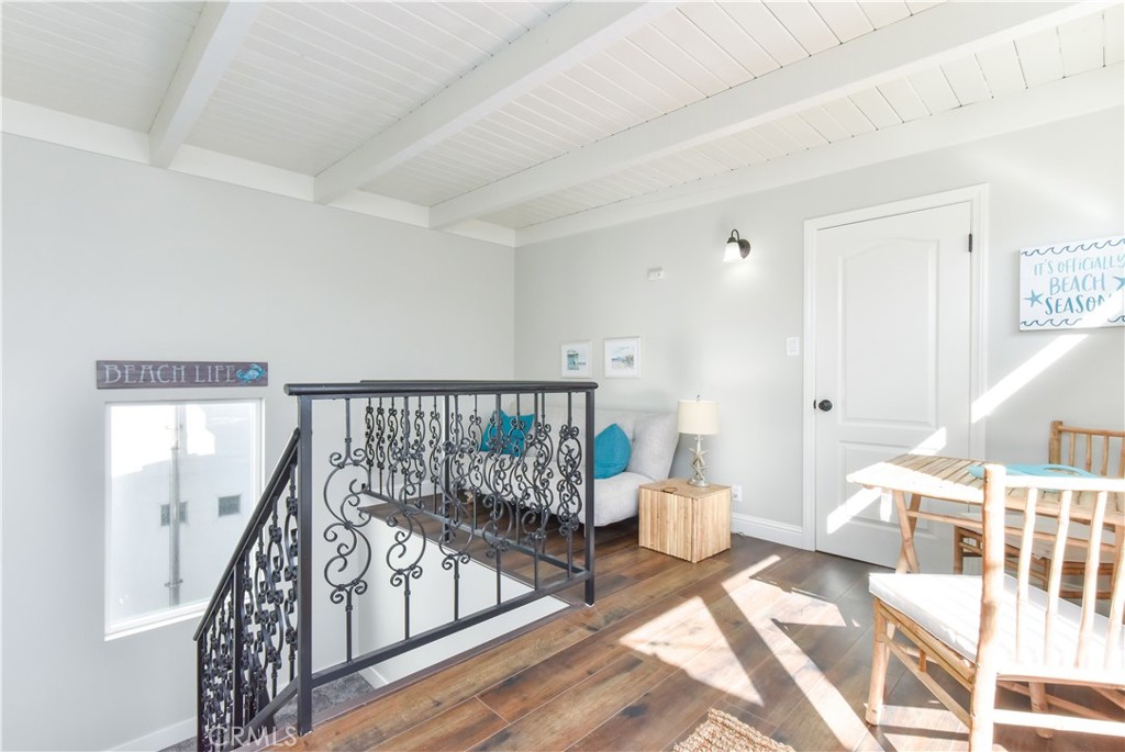 16791 Bayview Drive Huntington Beach, CA 90742 - Photo 63 of 75 a living room with furniture and a wooden floor
