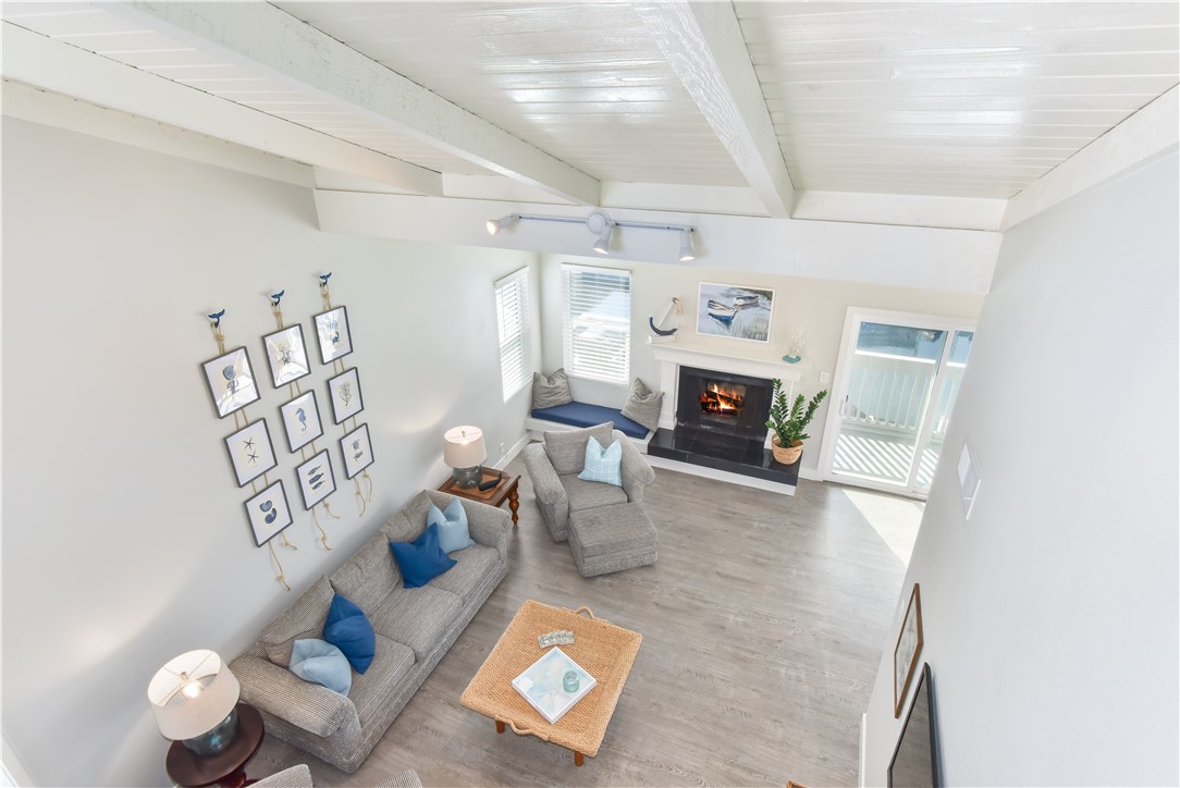 16791 Bayview Drive Huntington Beach, CA 90742 - Photo 65 of 75 a living room with furniture and a fireplace