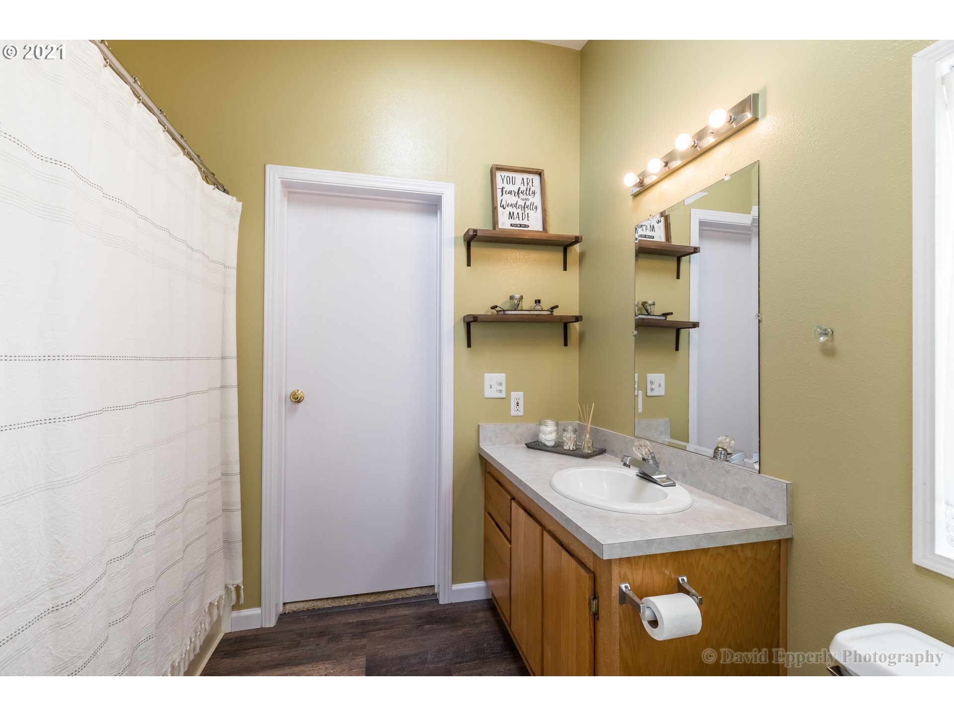 75040 Lewis Road Rainier, OR 97048 - Photo 11 of 22 a bathroom with a sink mirror and a shower