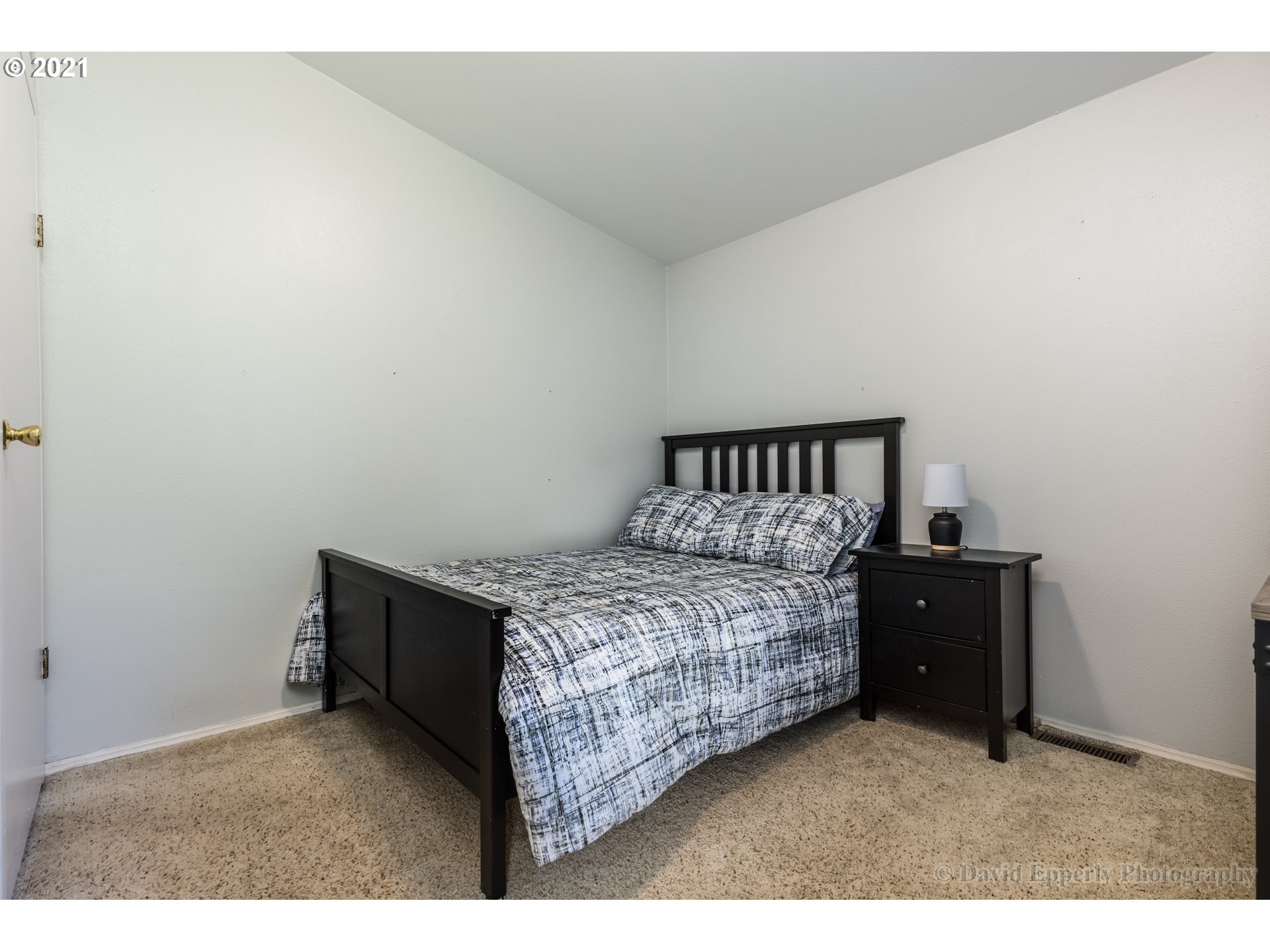 75040 Lewis Road Rainier, OR 97048 - Photo 14 of 22 a bedroom with a bed and a night stand
