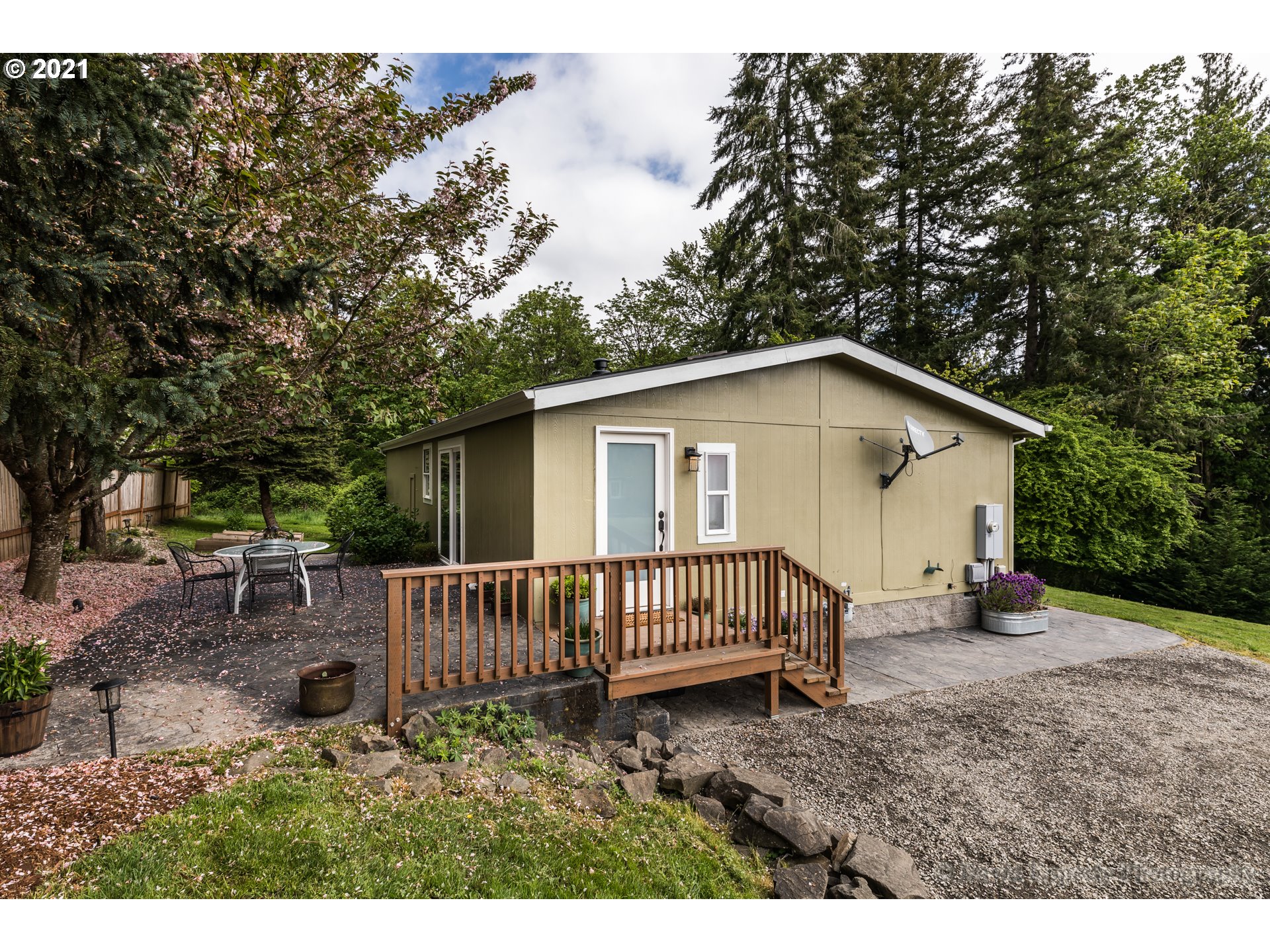 75040 Lewis Road Rainier, OR 97048 - Photo 15 of 22 a view of a house with a yard and deck