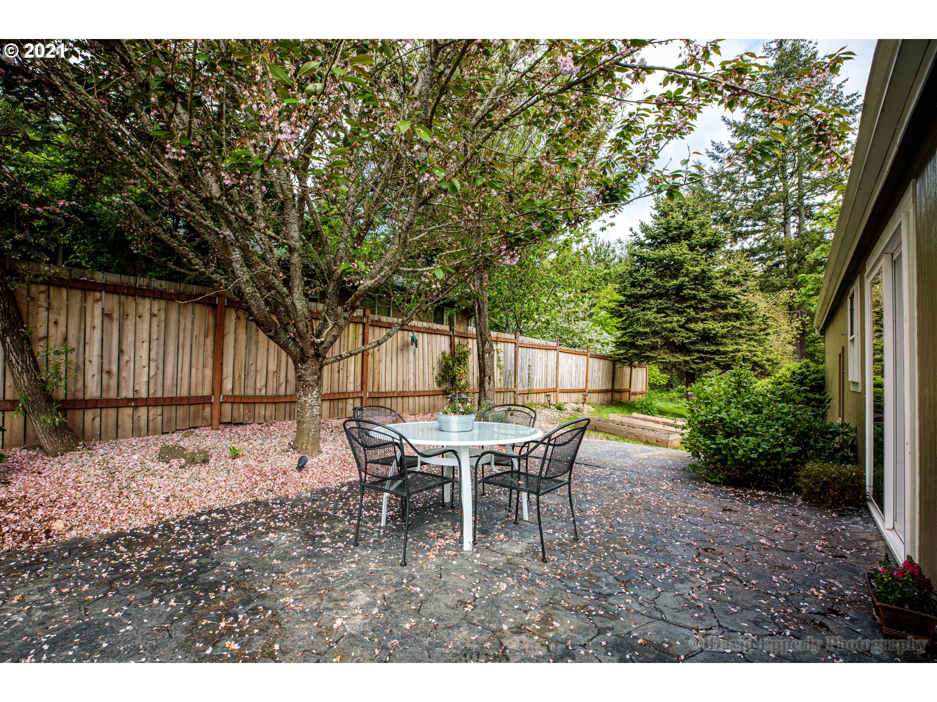 75040 Lewis Road Rainier, OR 97048 - Photo 17 of 22 a backyard of a house with table and chairs