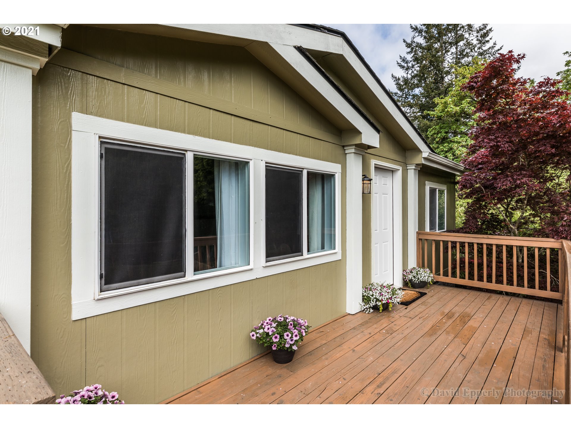 75040 Lewis Road Rainier, OR 97048 - Photo 3 of 22 a backyard of a house with wooden floor barbeque oven and outdoor seating