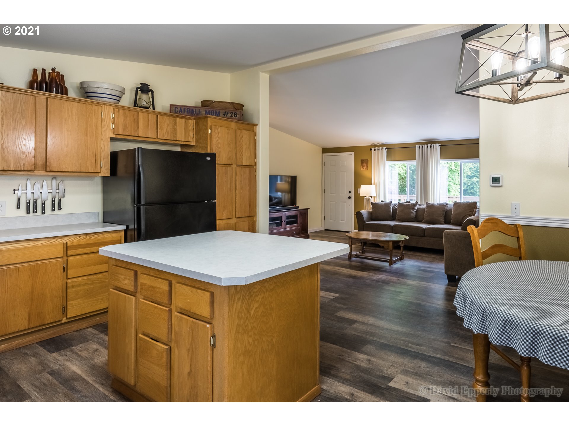75040 Lewis Road Rainier, OR 97048 - Photo 9 of 22 a kitchen that has a kitchen island wooden cabinets and refrigerator