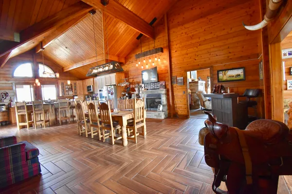 a view of a patio with dining table and chairs