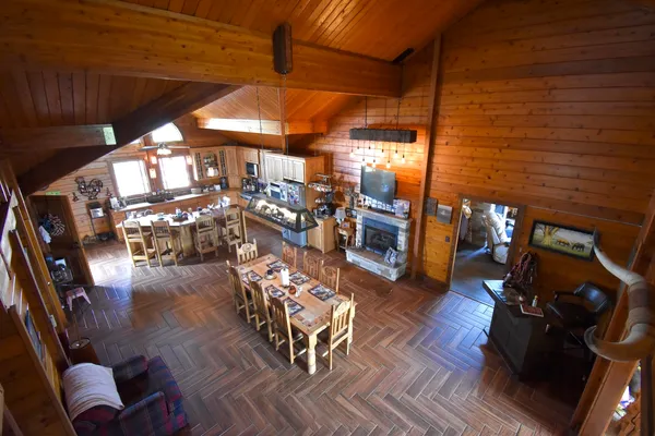 a view of a livingroom with furniture and a window