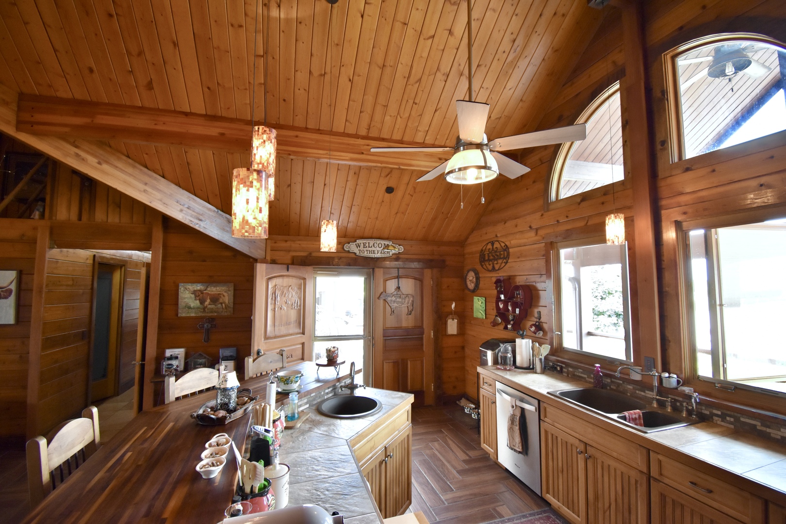 2951 North 28th Road Seneca, IL 61360 - Photo 15 of 53 a kitchen with stainless steel appliances kitchen island granite countertop a stove a refrigerator a dining table and chairs with wooden floor