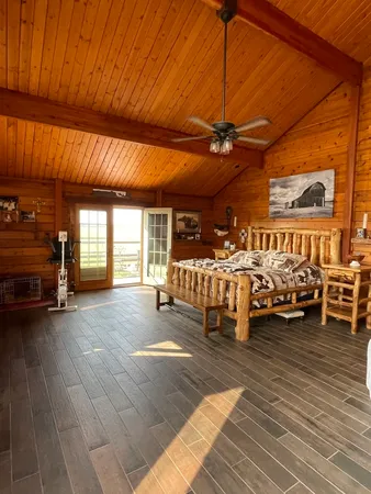 a bedroom with furniture and a chandelier