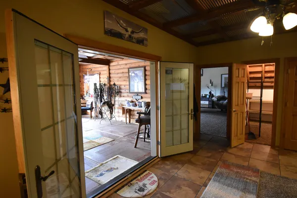 a living room with furniture and a walk in closet