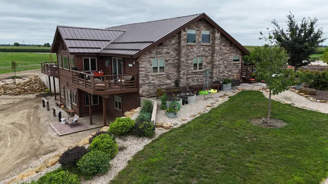 a front view of house with yard and green space