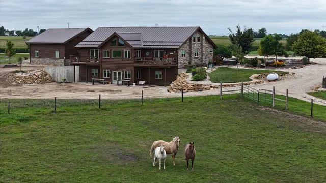 a front view of house with outdoor seating and yard