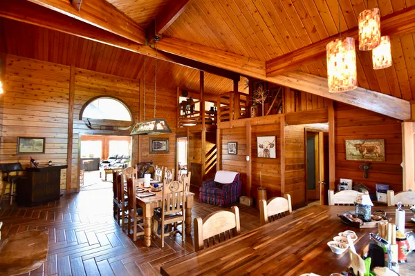 a view of a chairs and a table in a patio