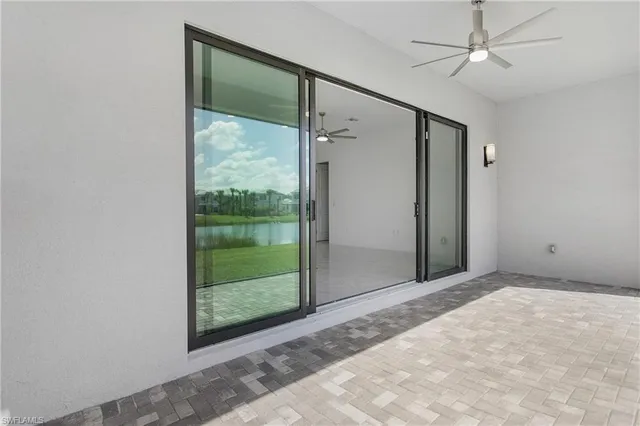 en empty room with sliding glass door and shower