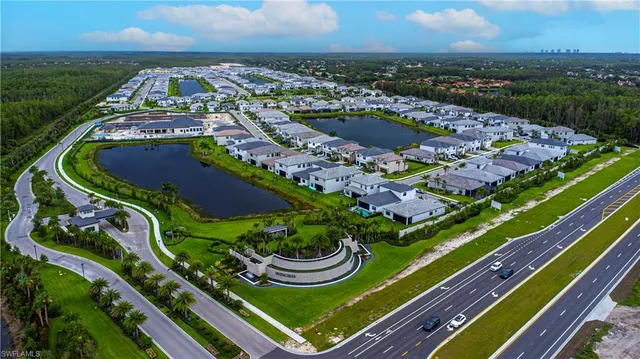 an aerial view of a residential houses with outdoor space