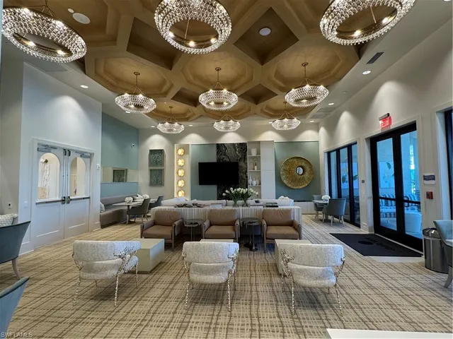 a view of a patio with a table and chairs under an umbrella