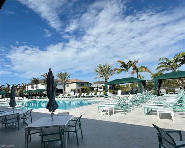 a view of a swimming pool with a lounge chairs