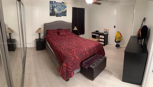 a bedroom with bed and window