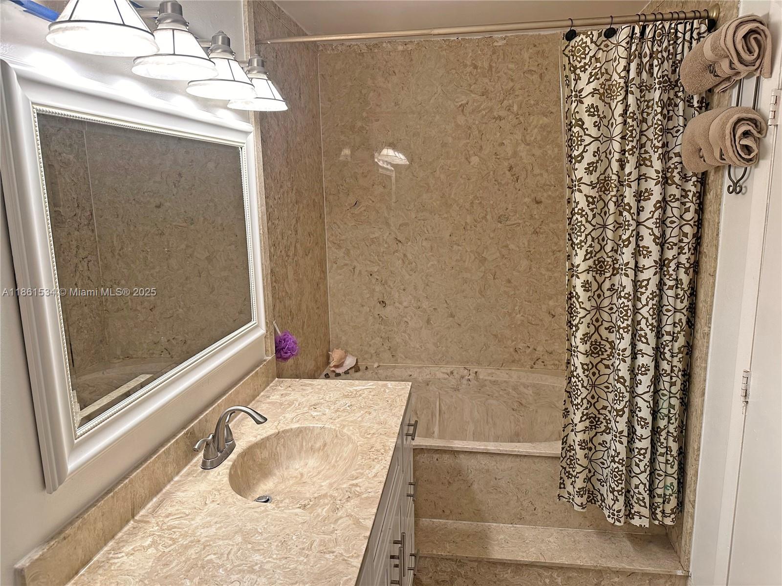 22 Crossings Circle, Unit E Boynton Beach, FL 33435 - Photo 14 of 28 a bathroom with a granite countertop shower and a sink