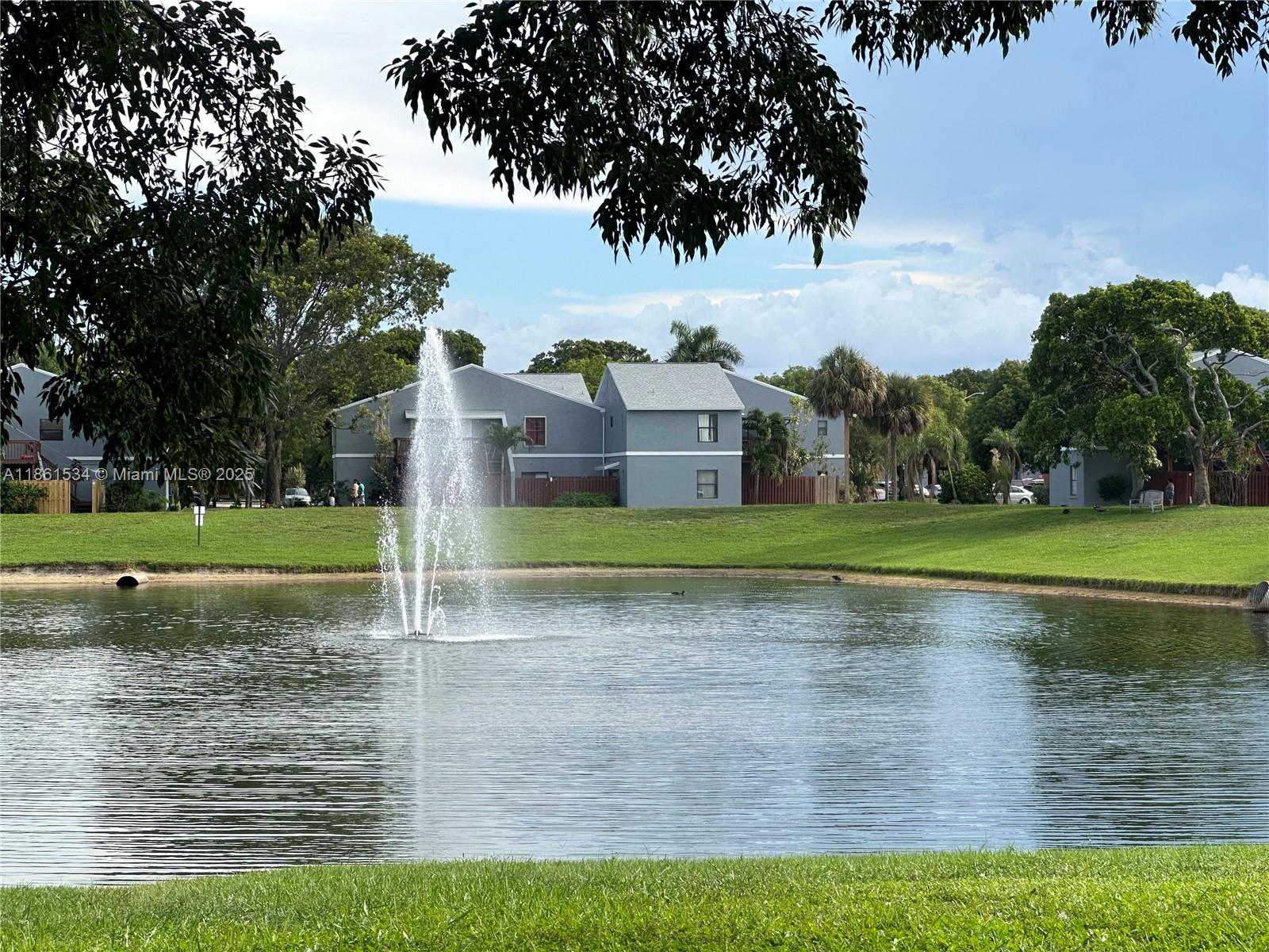 22 Crossings Circle, Unit E Boynton Beach, FL 33435 - Photo 22 of 28 a view of a house with a big yard