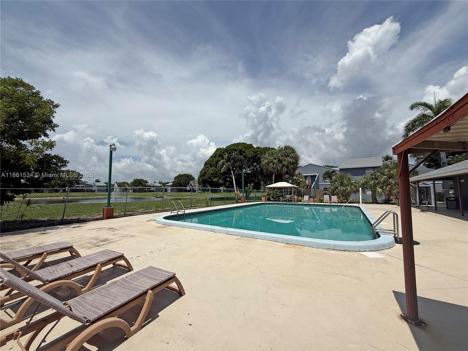 22 Crossings Circle, Unit E Boynton Beach, FL 33435 - Photo 27 of 28 a view of a backyard