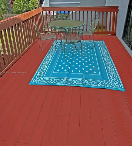 a balcony with wooden floor